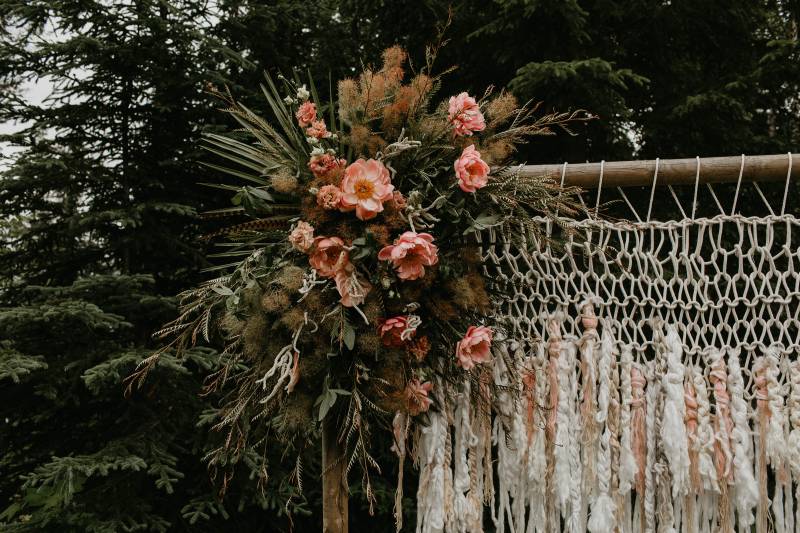 Macramé wedding arch with blush floral arrangement 