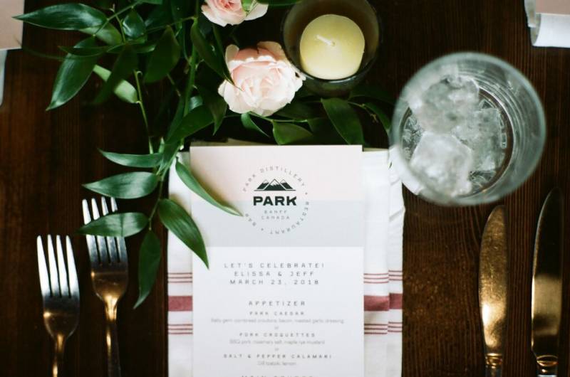 Wedding menu and place setting flat lay with blush rose 