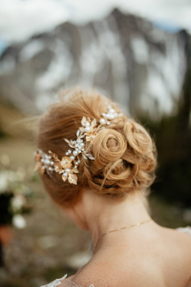 Bride with hair in a bun and flower crown 