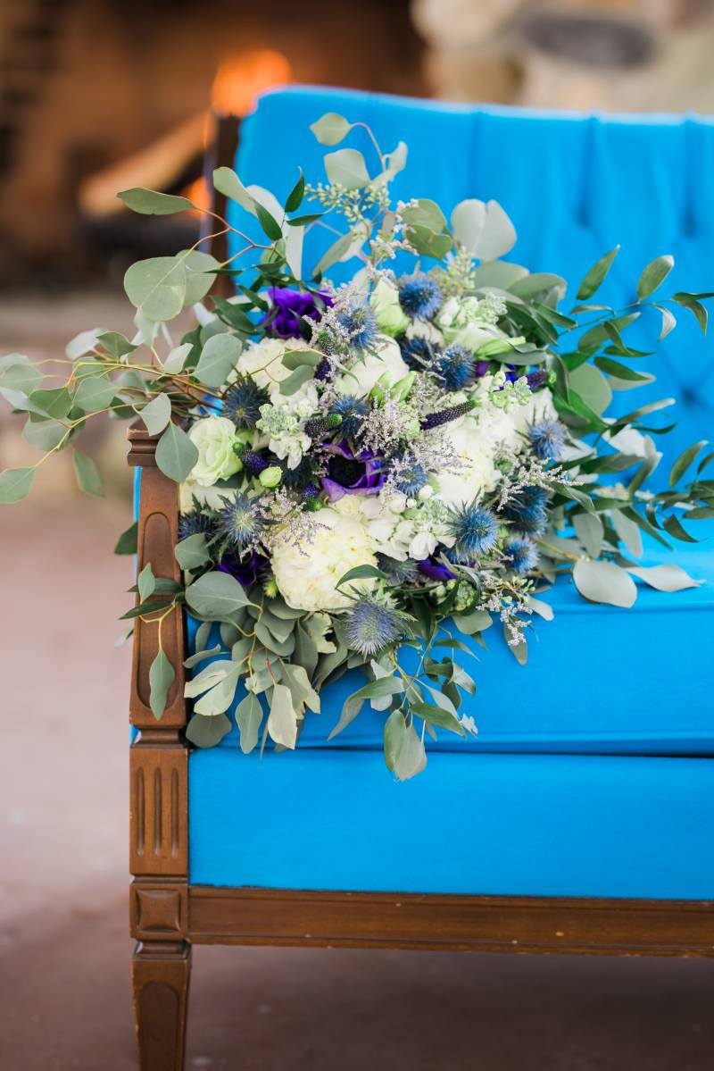 Cobalt purple and white bouquet on blue chair 