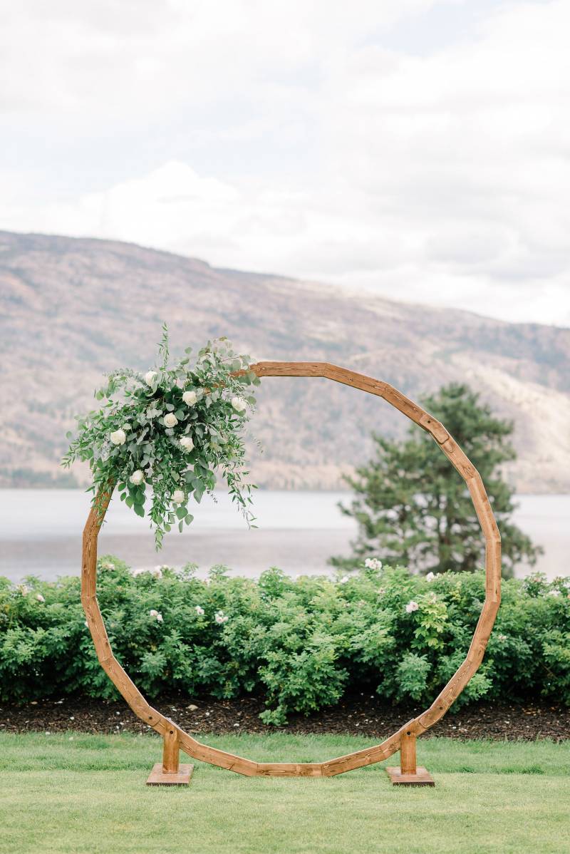Large circular wedding arch with white floral arrangement 