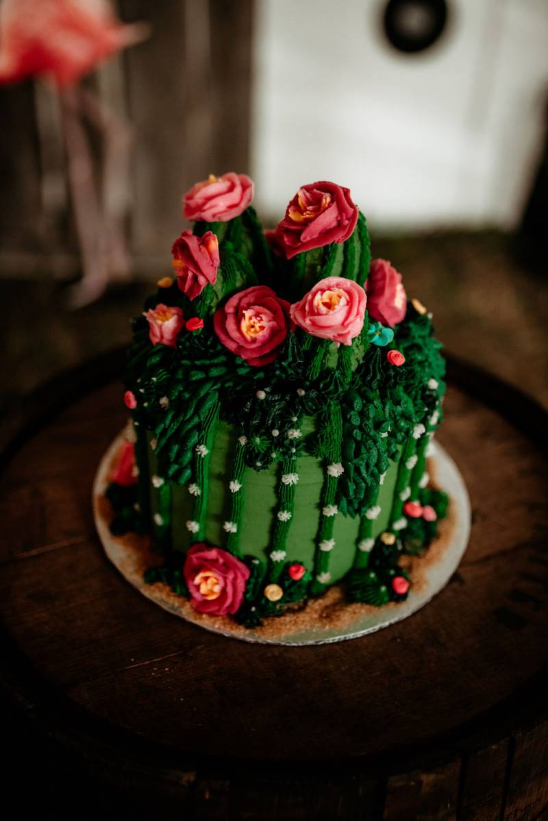 Cactus wedding cake with pink floral accents 