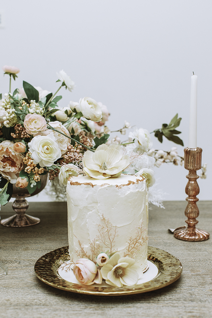 White wedding cake with blush accents 