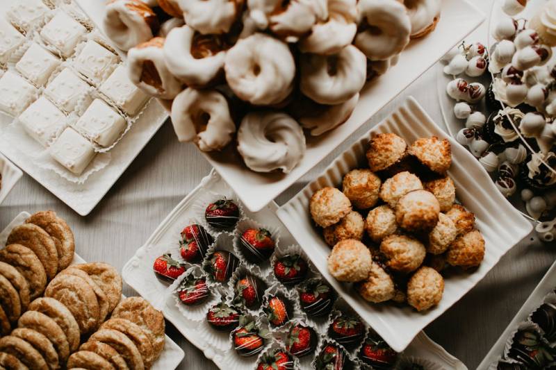 Various baked goods laid out on white table 