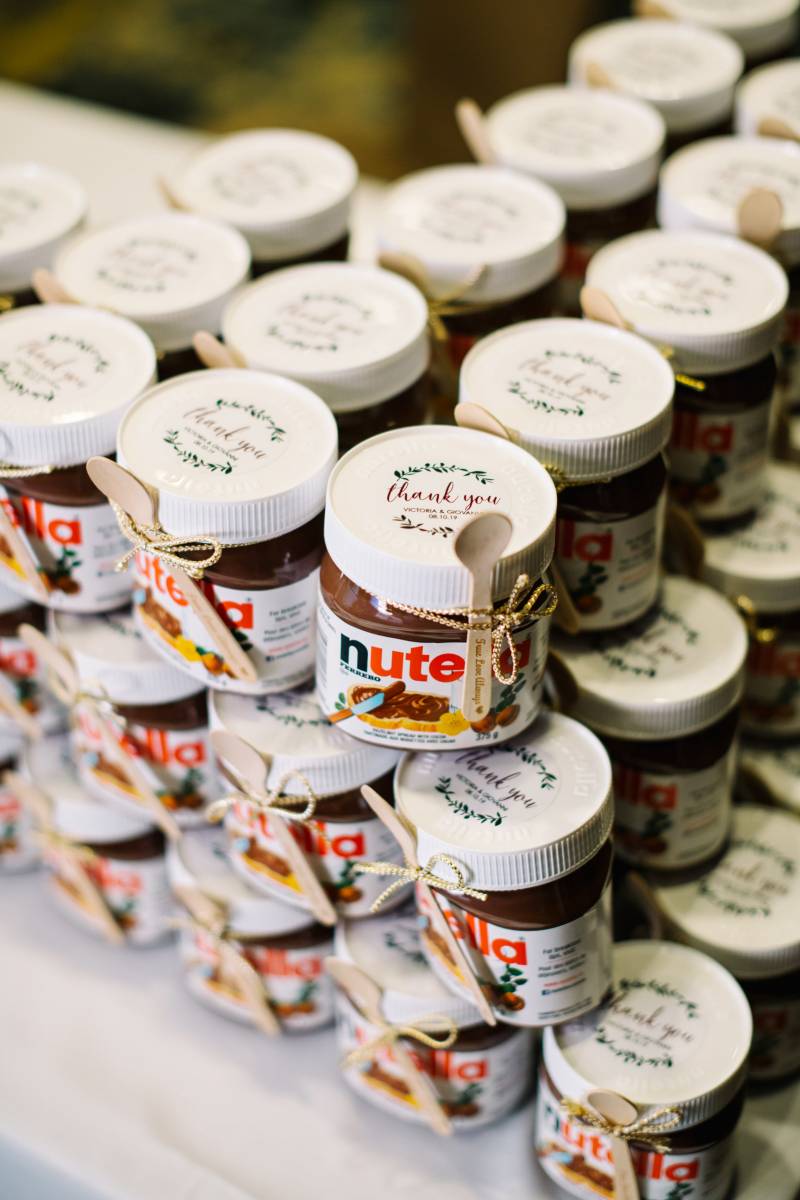 Personal sized nutella wedding favours tied with wooden spoons 