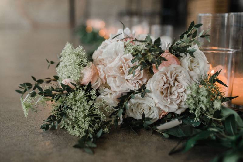 White and blush bouquet laying on a table