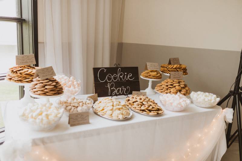 White table with black sign and white lettering cookie bar 