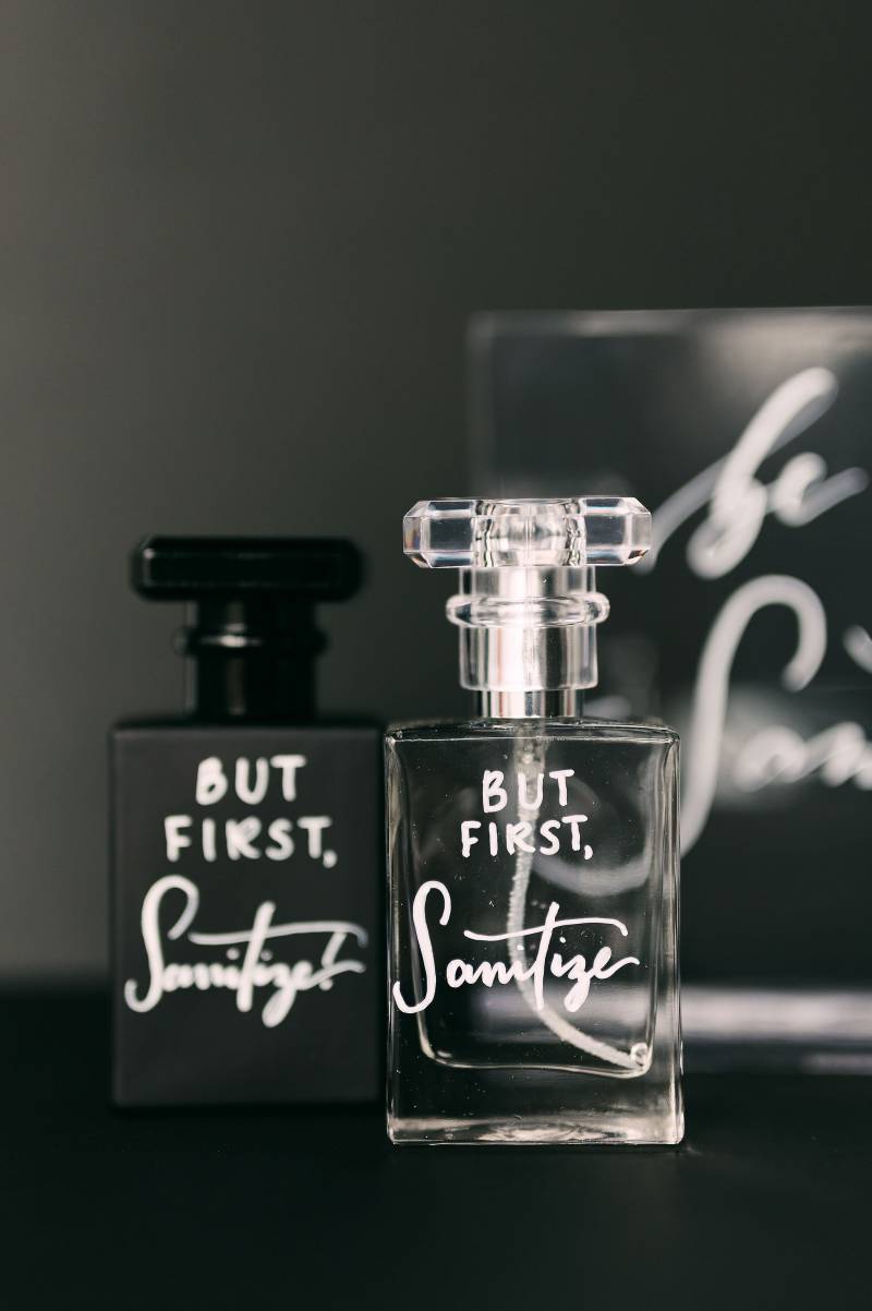 Glass bottles with white writing 
