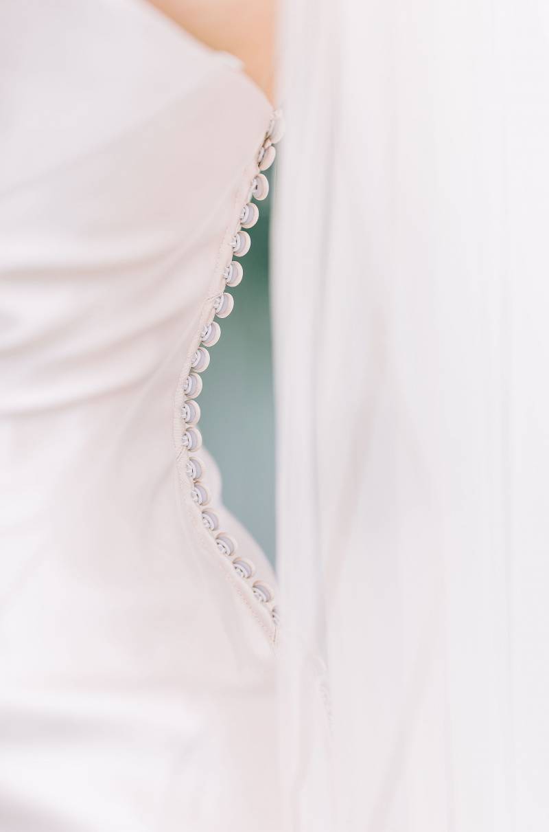 Embroidery on the side of white wedding dress 