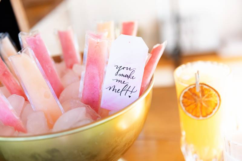 Pink and blush ice pops in gold bowl