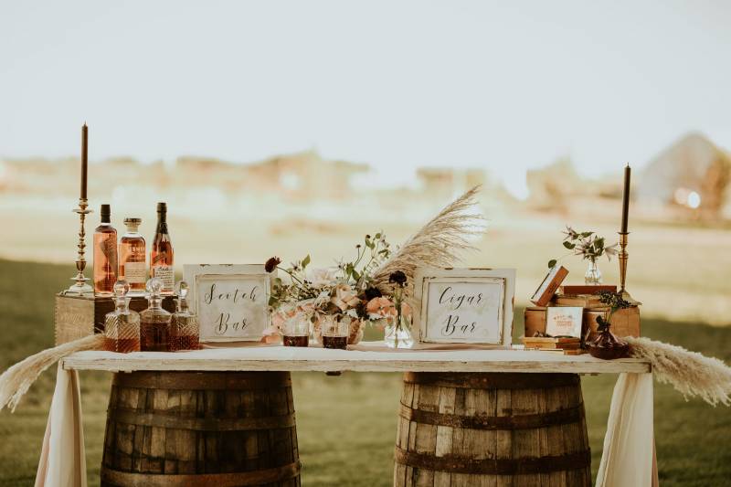 Scotch bar on wood table supported by wooden barrels 