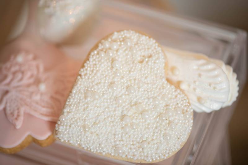 Heart cookie decorated with white candy balls  