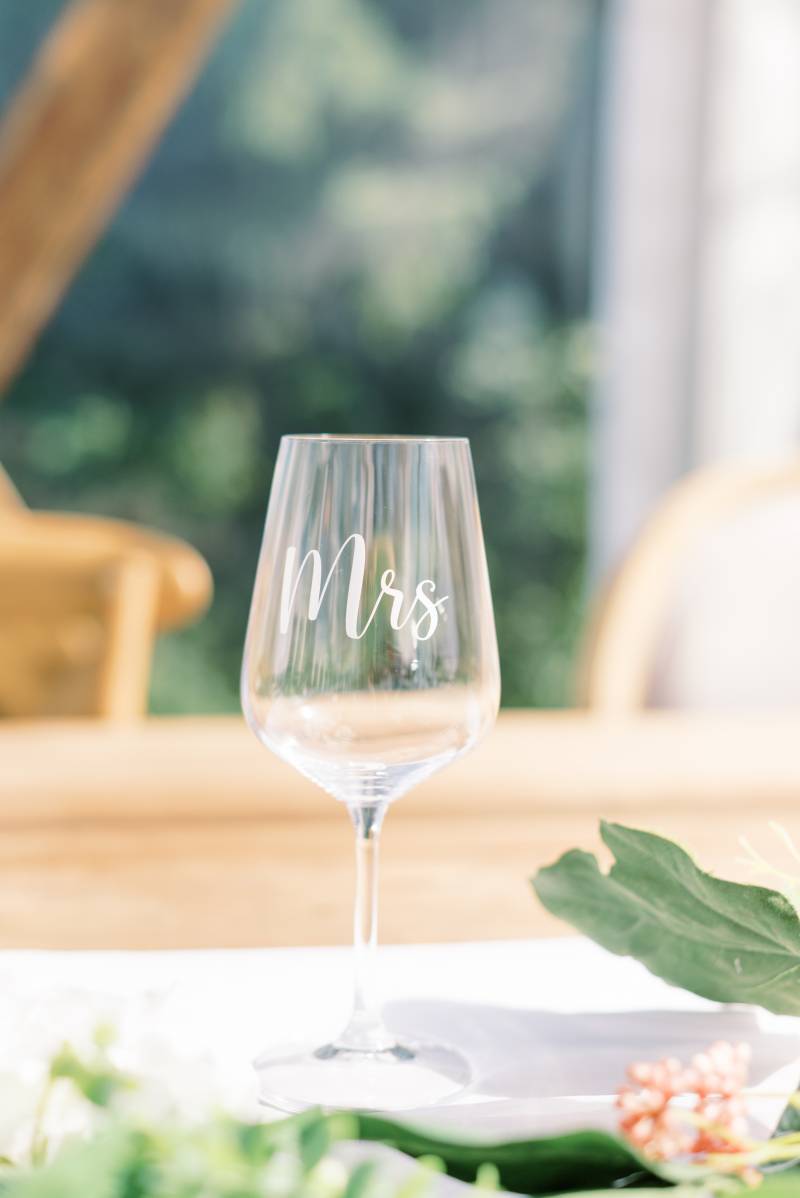 Wine glass with Mrs. in white lettering 