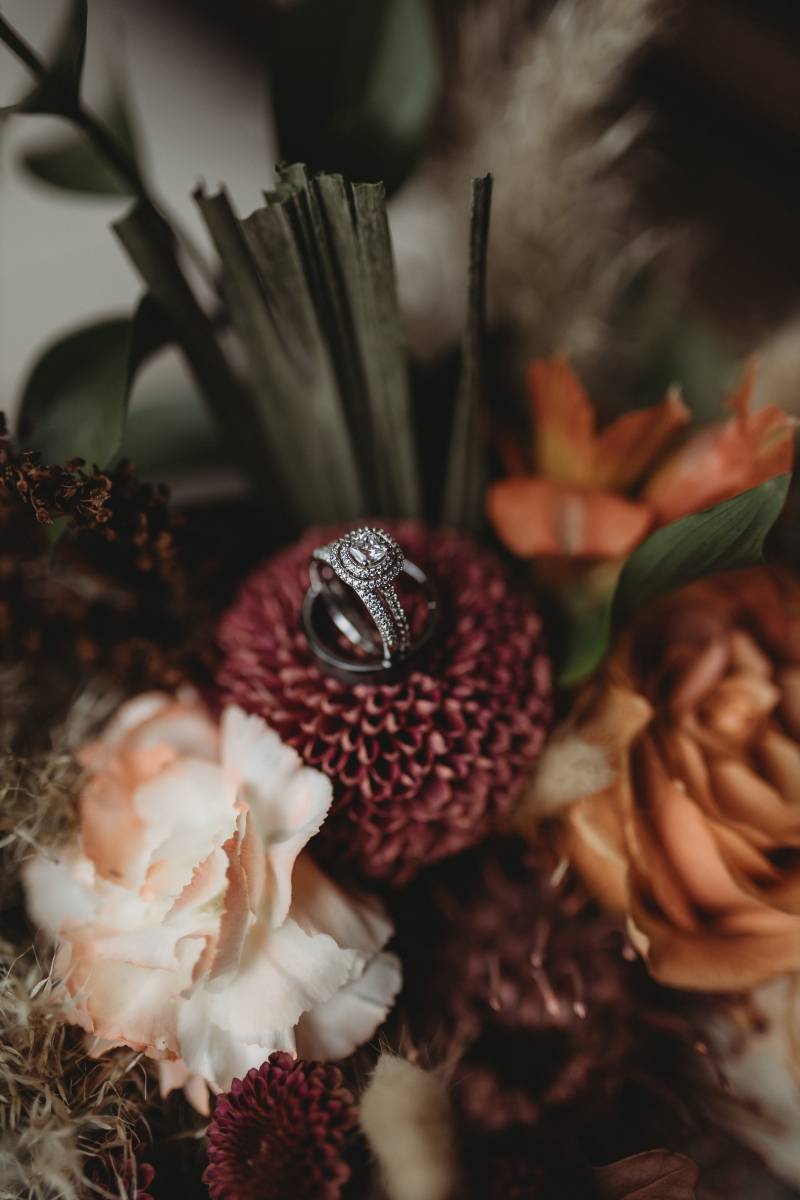 Engagement ring on a burgundy flower